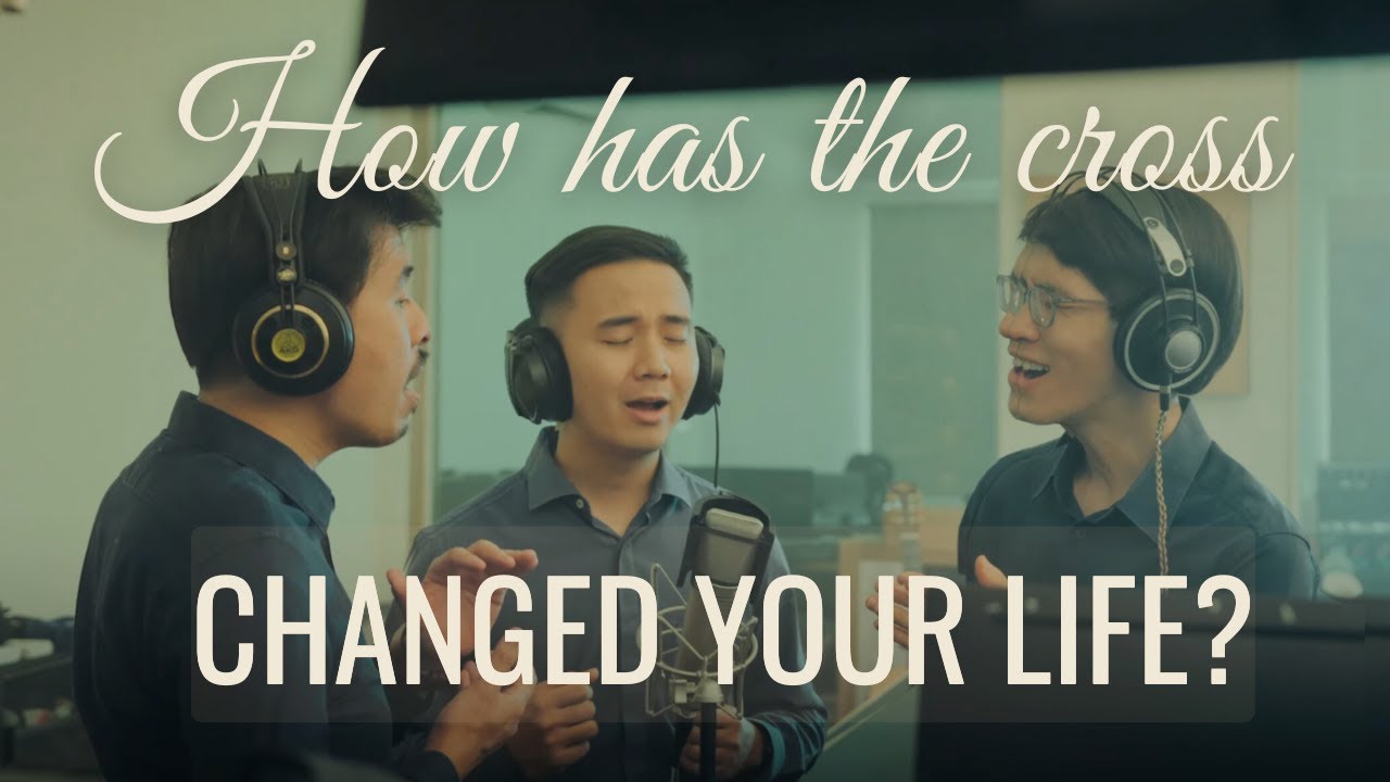 Thumbnail for the music video &ldquo;The Cross Made The Difference For Me&rdquo; — three singers with headphones around a studio microphone beneath the words &lsquo;How has the cross changed your life?&rsquo;