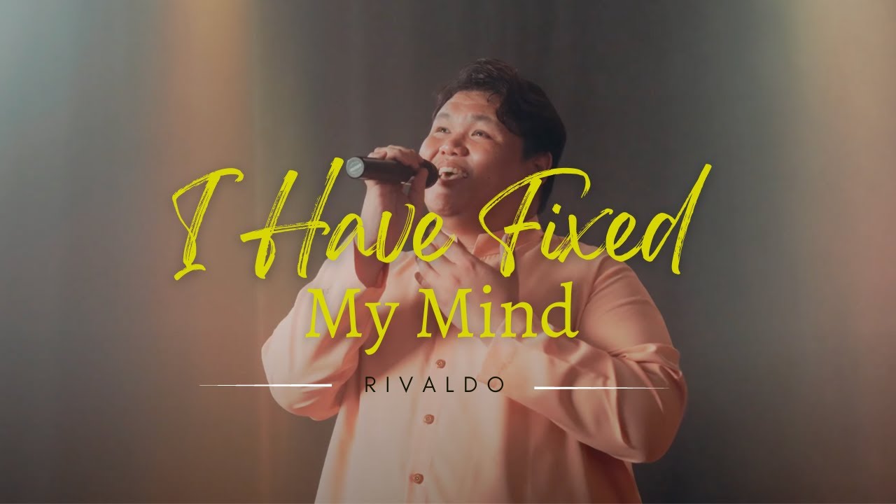 Thumbnail for the music video &ldquo;I Have Fixed My Mind&rdquo; — Rivaldo Uvang Joeman singing into a microphone beneath the words &lsquo;I Have Fixed My Mind&rsquo;