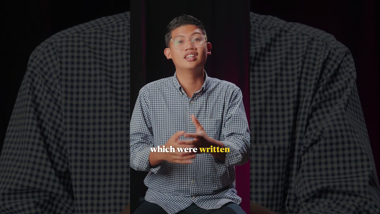 Thumbnail for the Short &ldquo;Why Heaven Is Writing Everything Down&rdquo; — a young man in a checked shirt with his hands clasped, speaking to camera