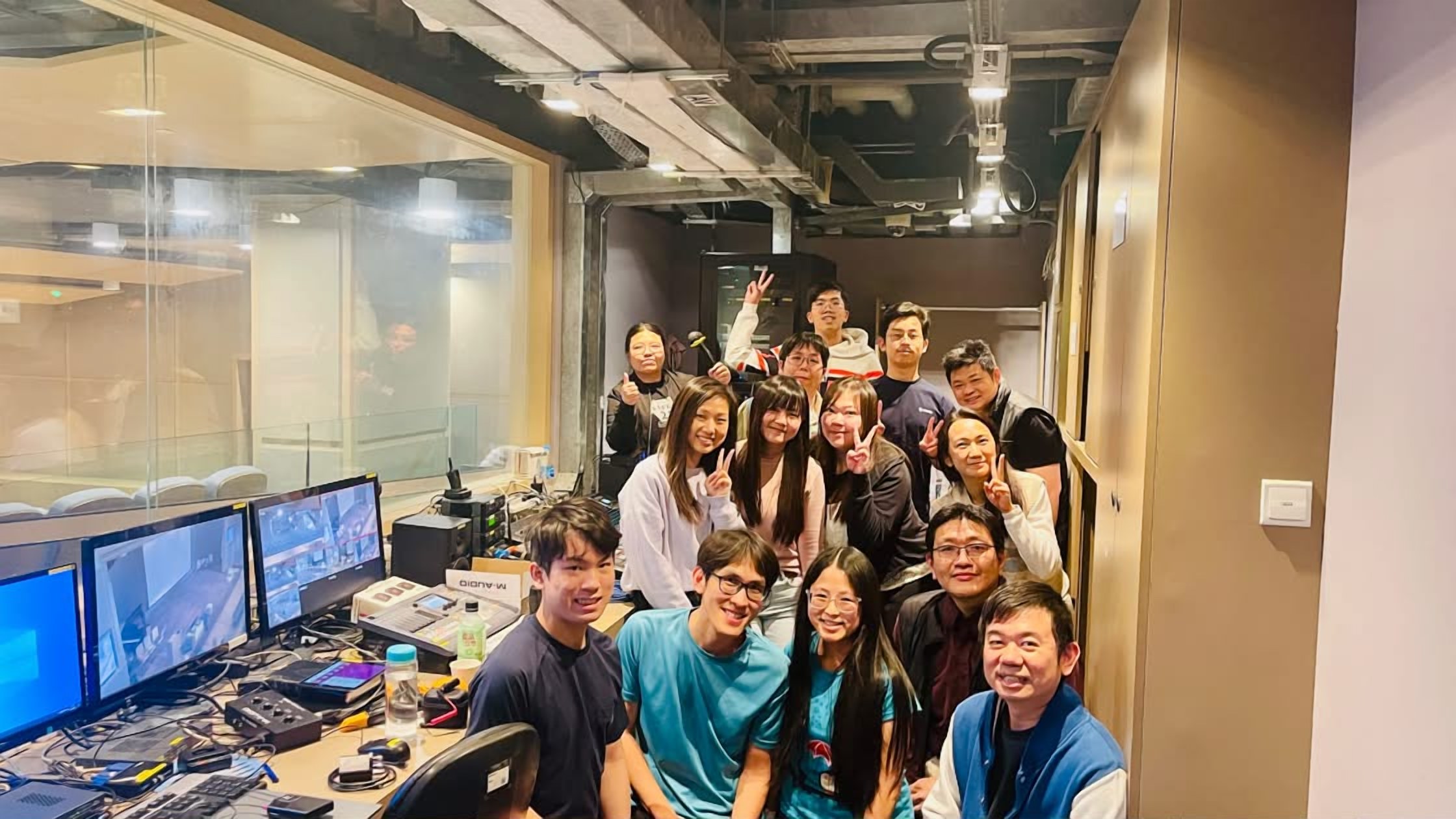 The Hong Kong media training group gathered in a broadcast control room, March 2025