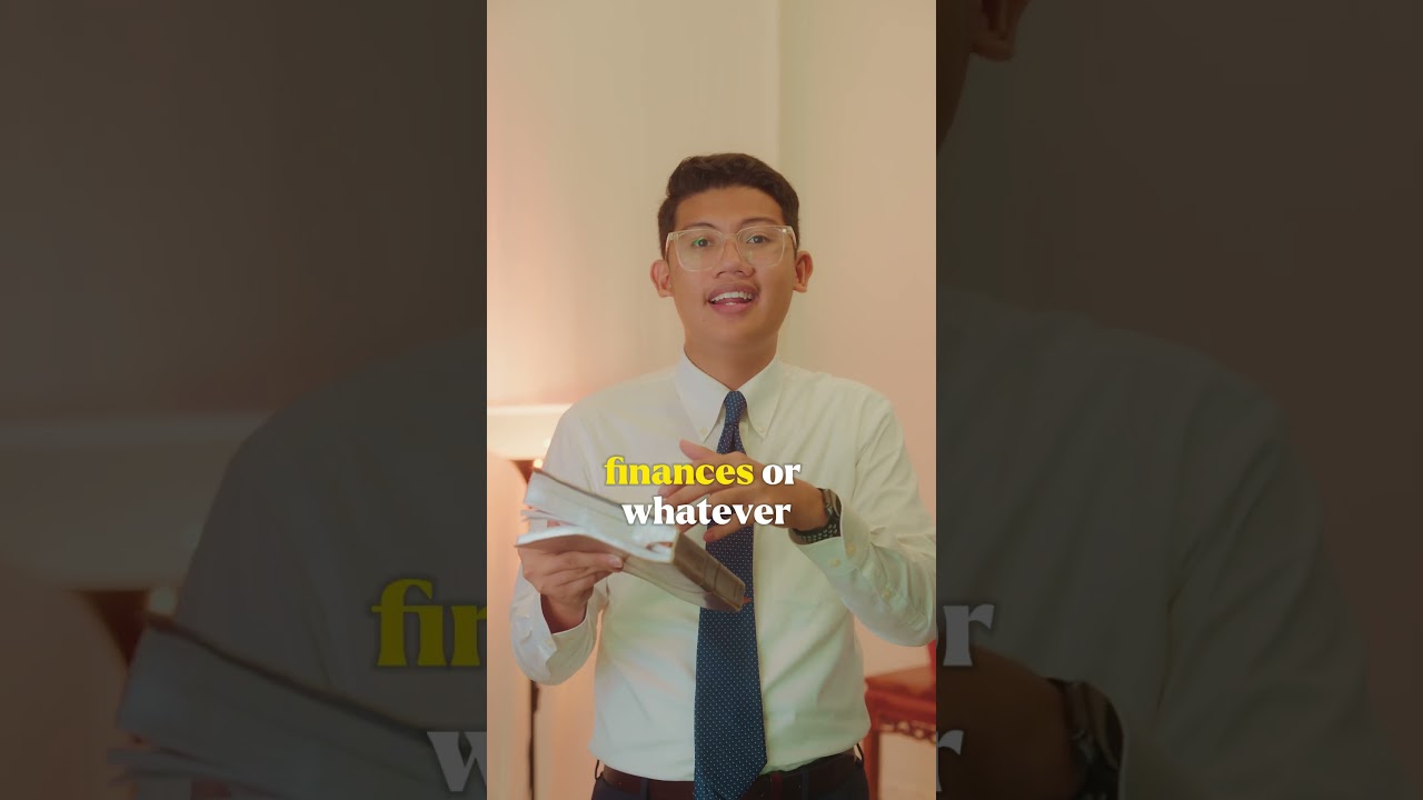 Thumbnail for the Short &ldquo;You Don&rsquo;t Own It. God Does. | 1 Corinthians 4:2&rdquo; — a young man in a shirt and tie holding an open book, speaking to camera