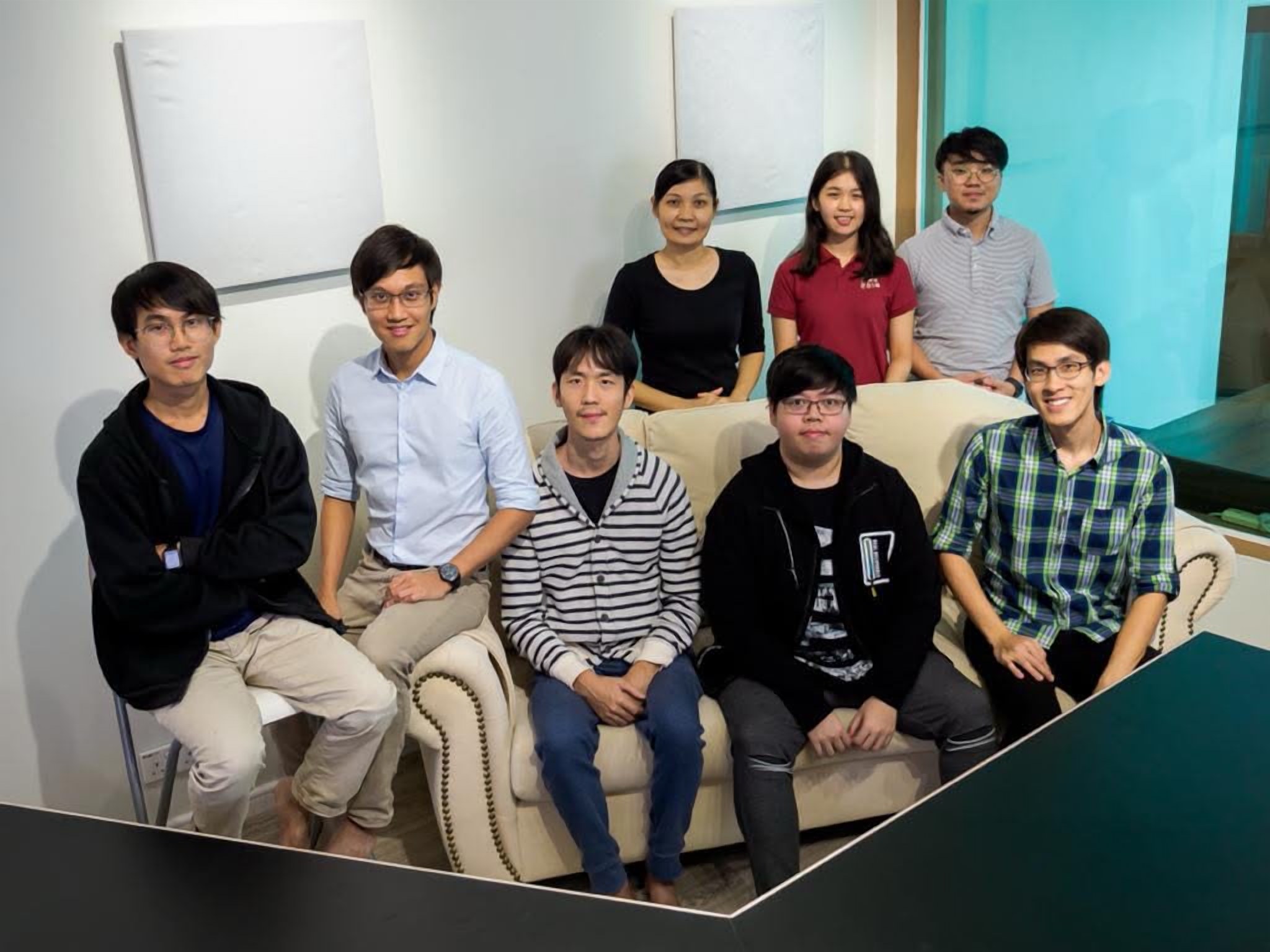 A group photo of LoudVoice's early volunteers gathered indoors in early 2020