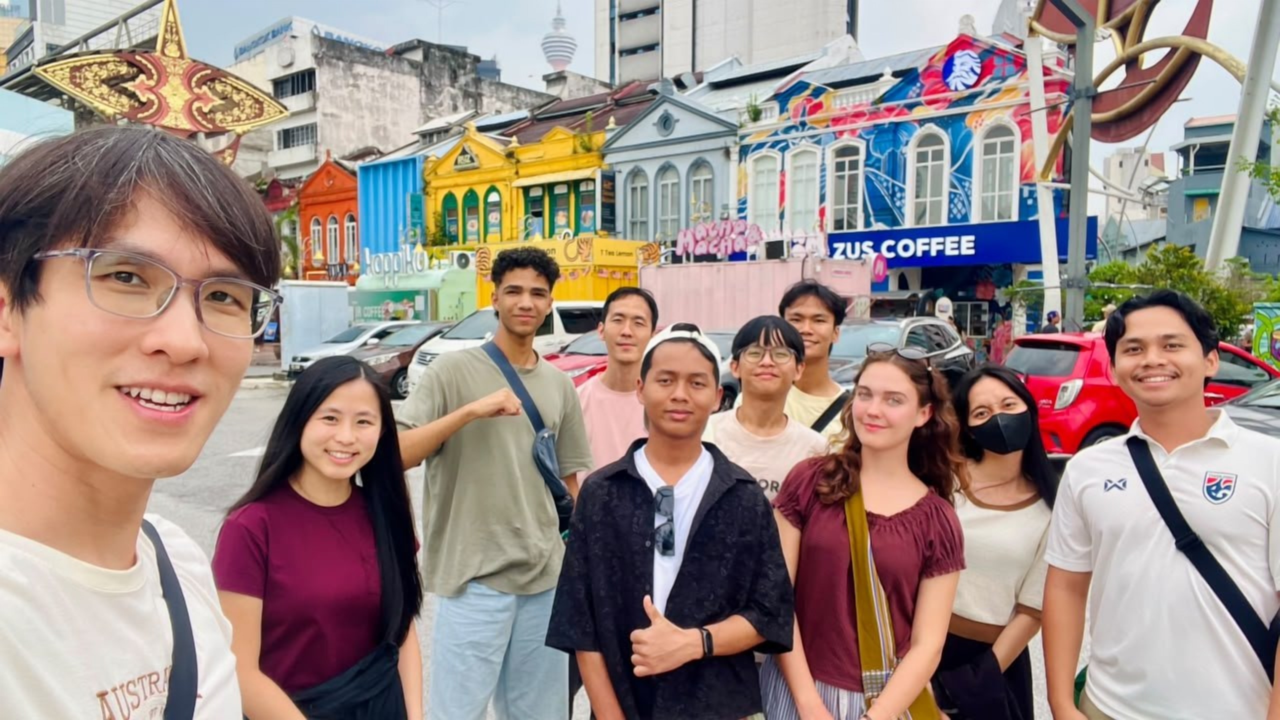 Volunteers exploring a colourful street in Kuala Lumpur